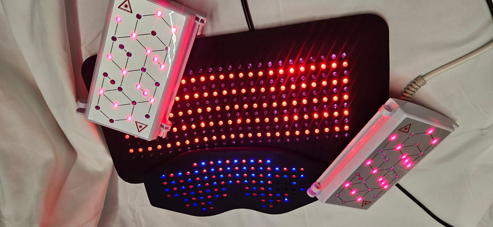 Red light therapy device glowing in a private treatment space